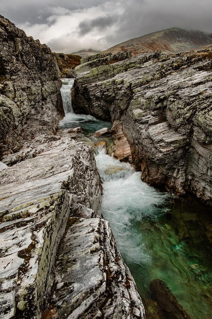 Autumn mountain landscape of rondane national park in norway waterfall near peer gynt hytta | The Web Univers