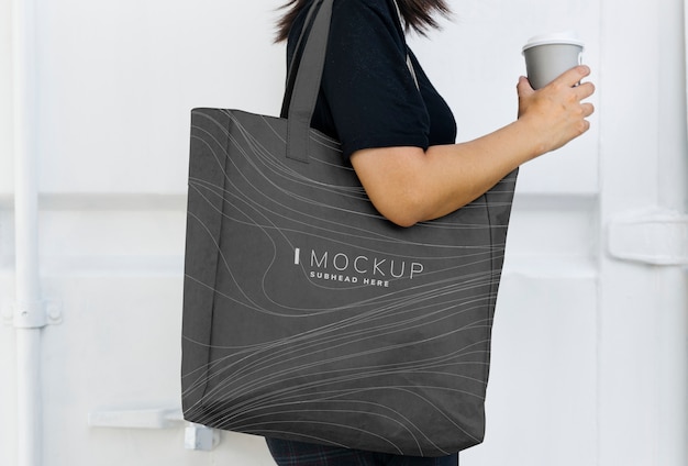 Woman carrying a black shopping bag mockup | The Web Univers