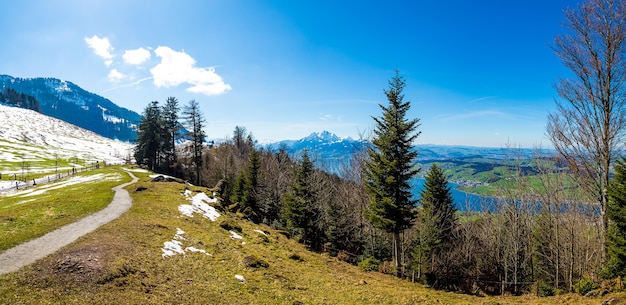 Panoramic shot of the beautiful mountains under the blue sky in switzerland | The Web Univers
