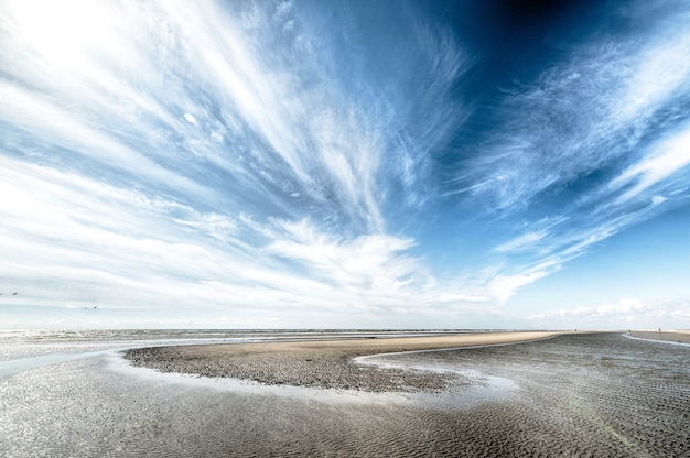Cloudy sky over dry island | The Web Univers