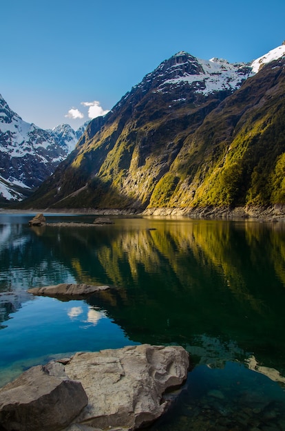 Vertical shot of the lake marian and mountains in new zealand | The Web Univers