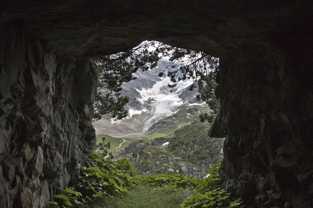 View of a mountain covered with snow seen from a tunnel | The Web Univers