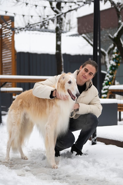 Full shot man with cute greyhound dog | The Web Univers
