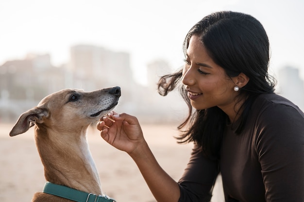 Medium shot smiley woman with cute dog | The Web Univers